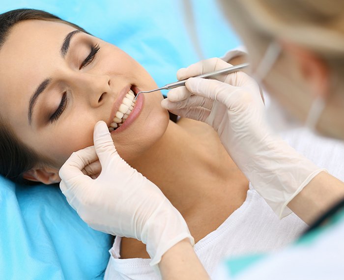 Dentist performing a dental checkup