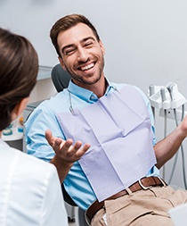 Man with dental implants in Gilbert smiling with dentist