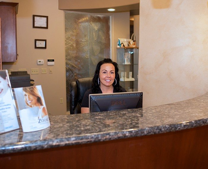 Dental team member at reception desk