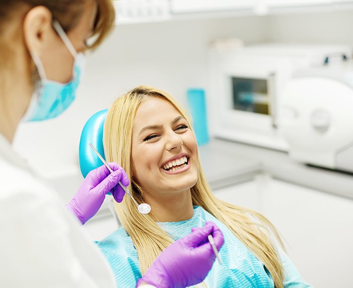 Woman at dentist for cleaning and checkup