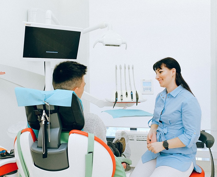 Man speaking with dentist