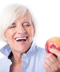 woman enjoying the health benefits of dental implants in Gilbert