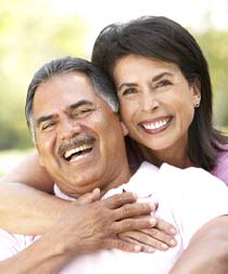 happy couple enjoying the long-term benefits of dental implants in Gilbert