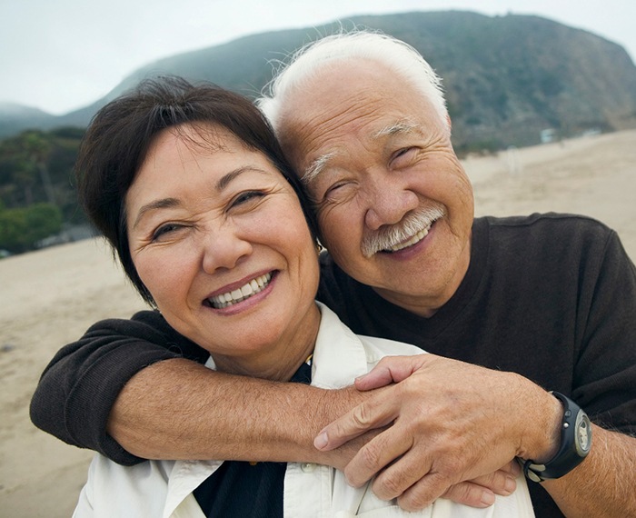 Man and woman with dental implants in Gilbert