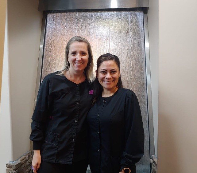 Two smiling dental team members in Gilbert