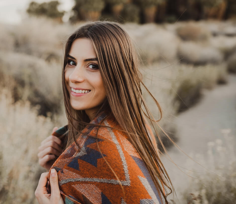 Woman smiling in grassy field