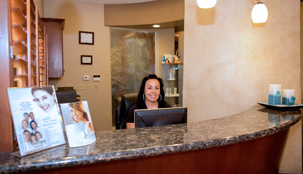 Dental team member at reception desk