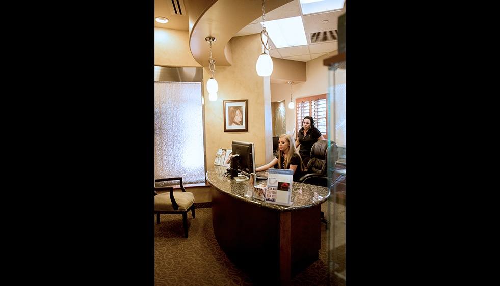 Two dental team members in consultation area