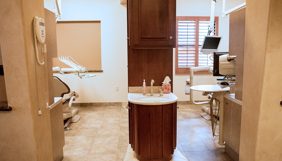 Hallway looking in to two dental treatment rooms