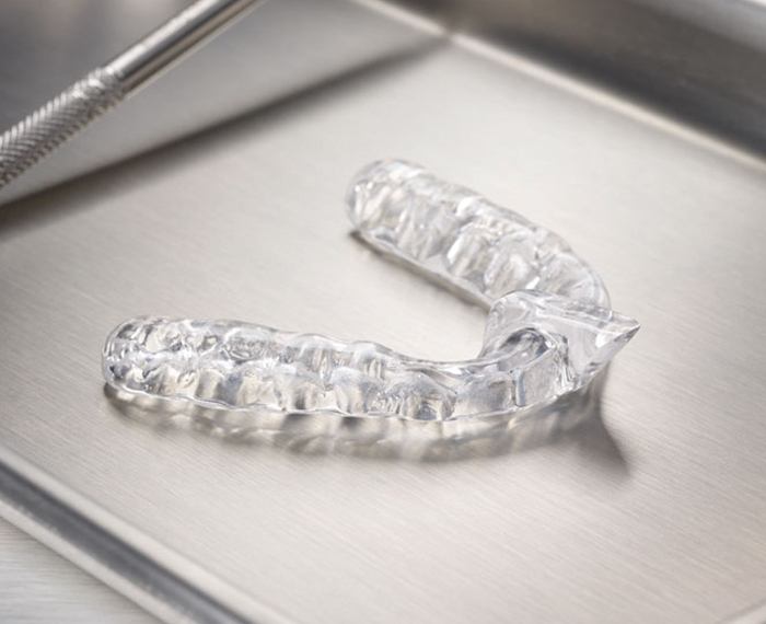 Clear nightguard for bruxism on metal tray