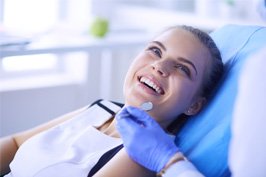 patient smiling after scaling and root planing