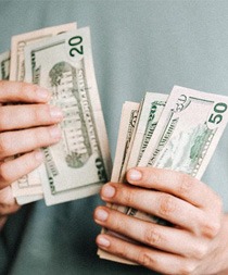 Man’s hands counting cash