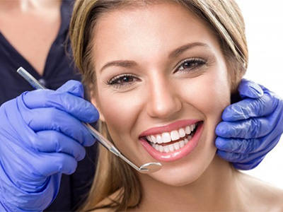 a smiling after receiving dental bonding in Gilbert, AZ